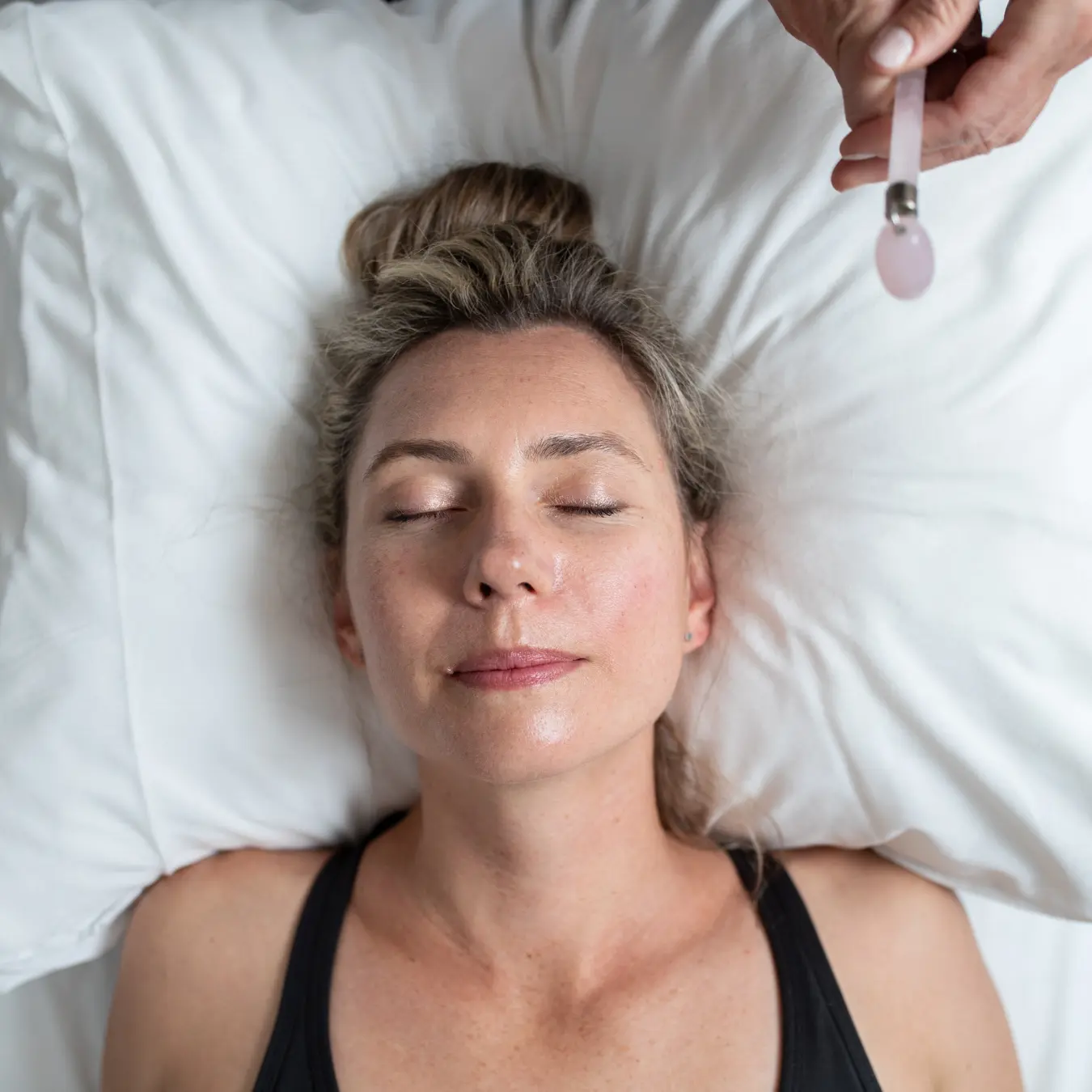 Patient relaxing during acupuncture treatment for perimenopause and menopause support